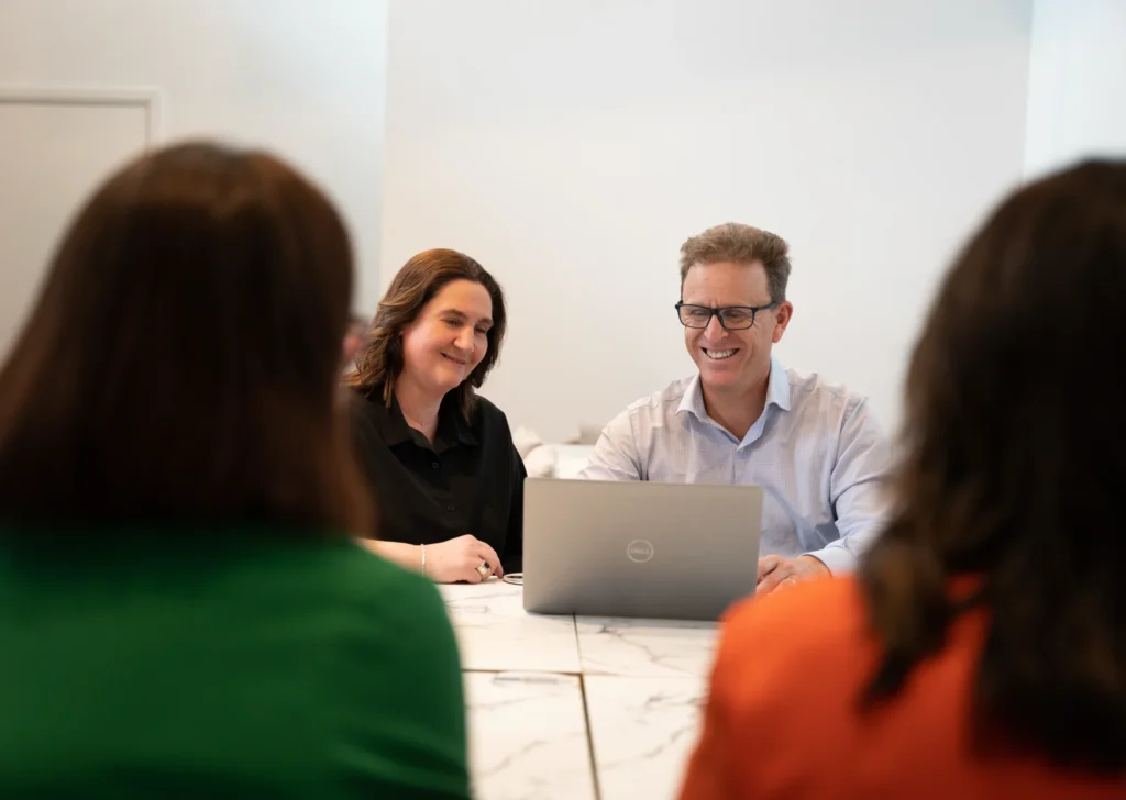 Zest Canberra members in conversation around a meeting table