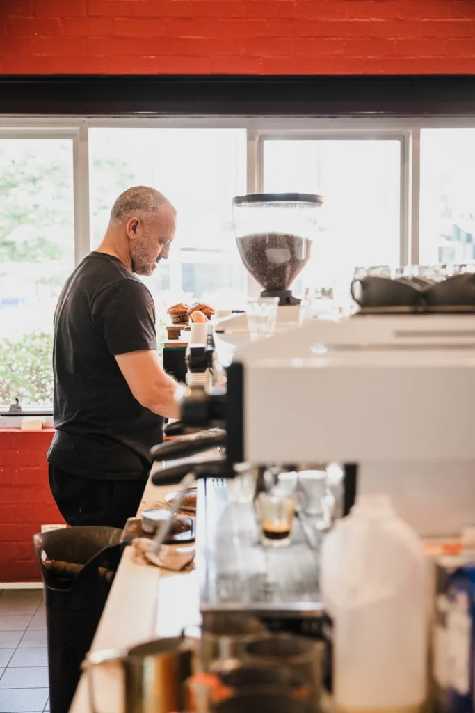 Cafe owner making coffee